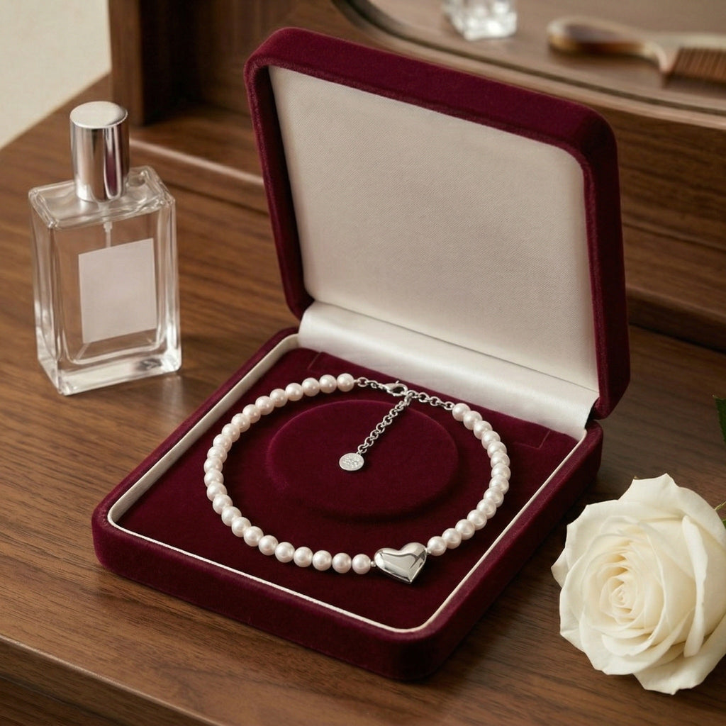 Timeless Pearl Necklace with Heart-Shaped Silver Pendant