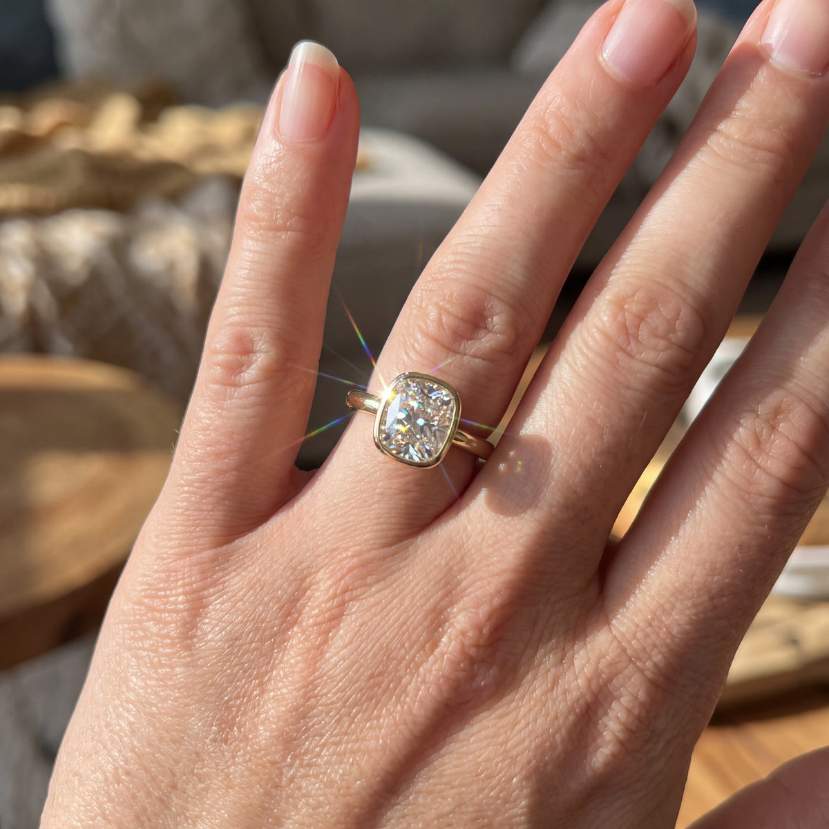 Cushion-Cut Sparkle Framed by a Smooth Bezel — natural wearing view