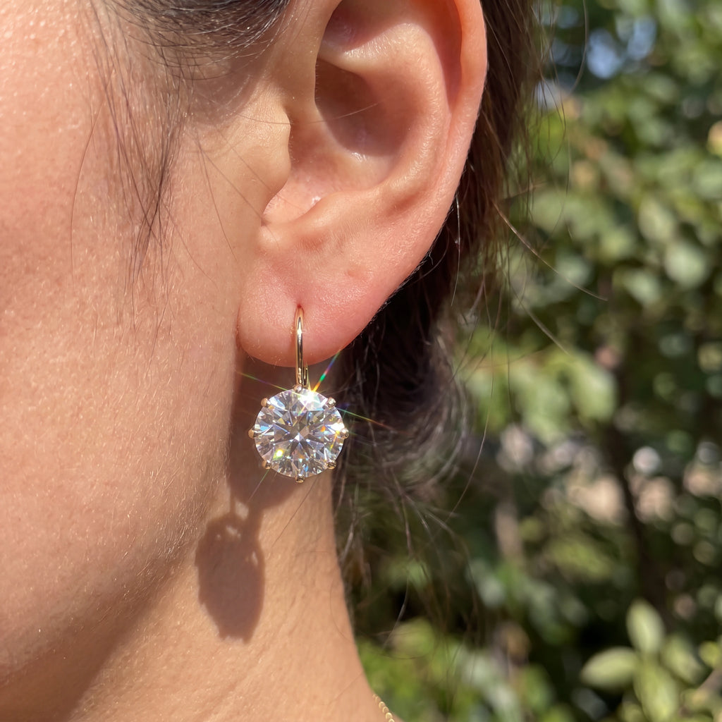 A Classic Solitaire Drop with a Leverback Closure — natural wearing view