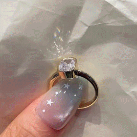 Cushion-Cut Sparkle Framed by a Smooth Bezel — moving product demonstration