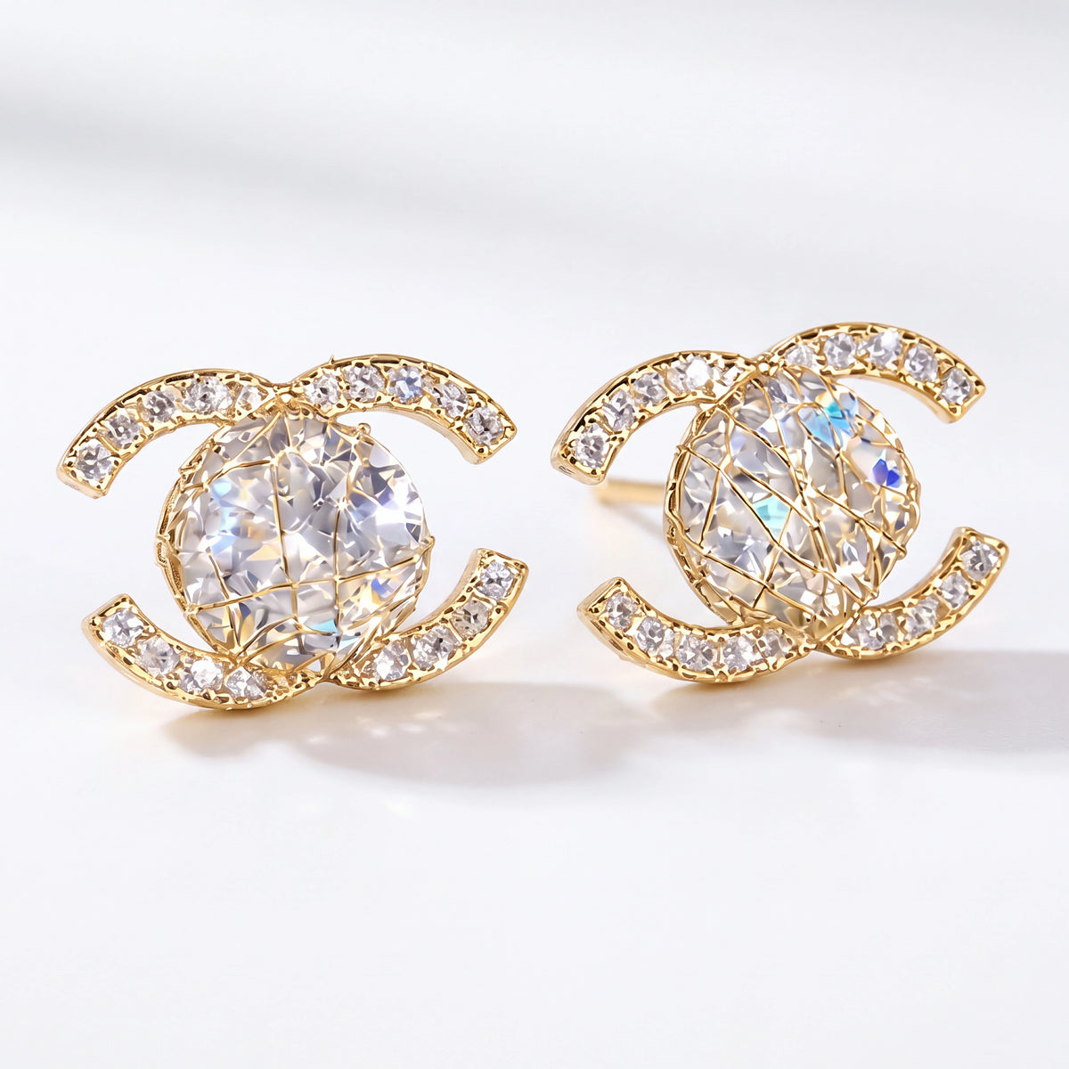 Gold interlocking halo stud earrings