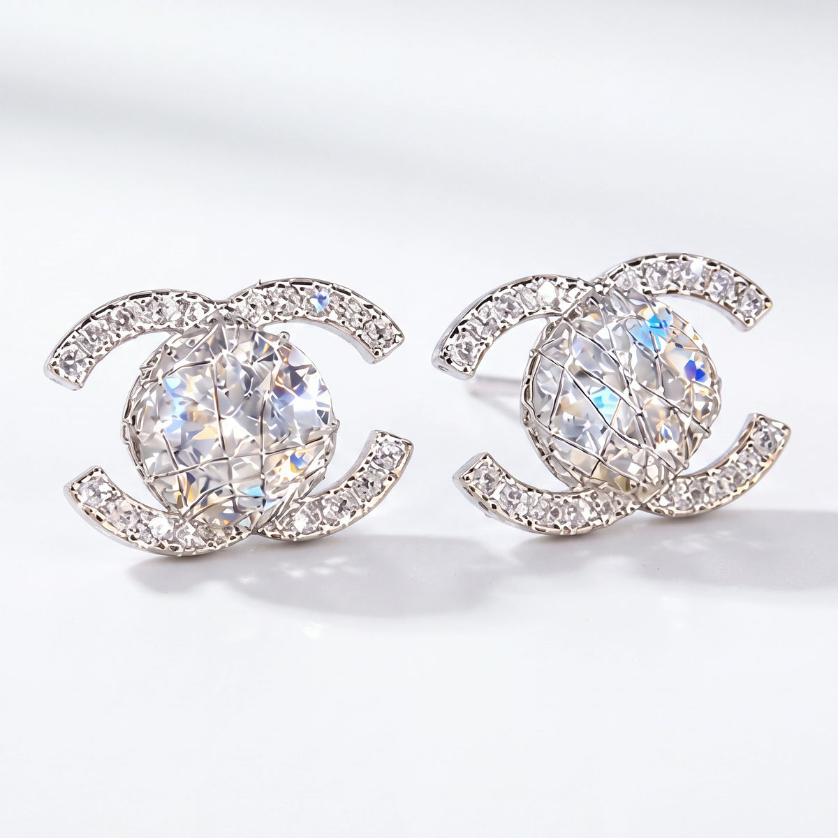 Silver interlocking halo stud earrings