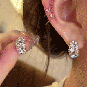 Three-stone curved studs shown in motion