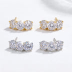 Gold-tone and silver-tone pairs of three-stone studs